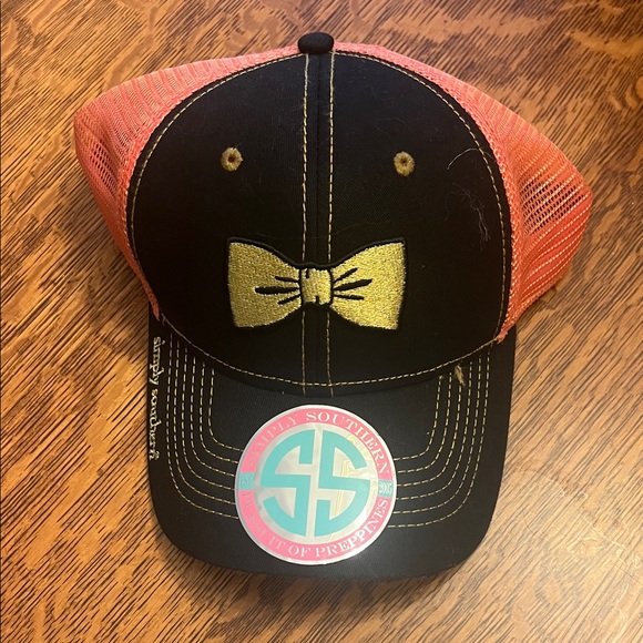 Simply Southern cap - Pink & Black with Gold Bow.
Mesh Trucker Hat. Adjustable - Picture 1 of 7